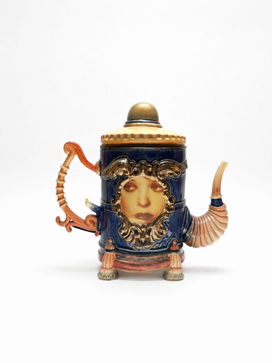 Face in Large Blue & Gold Tea Pot
