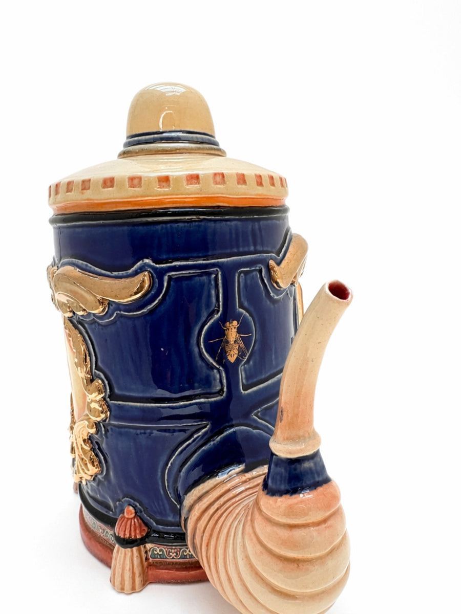 Face in Large Blue & Gold Tea Pot