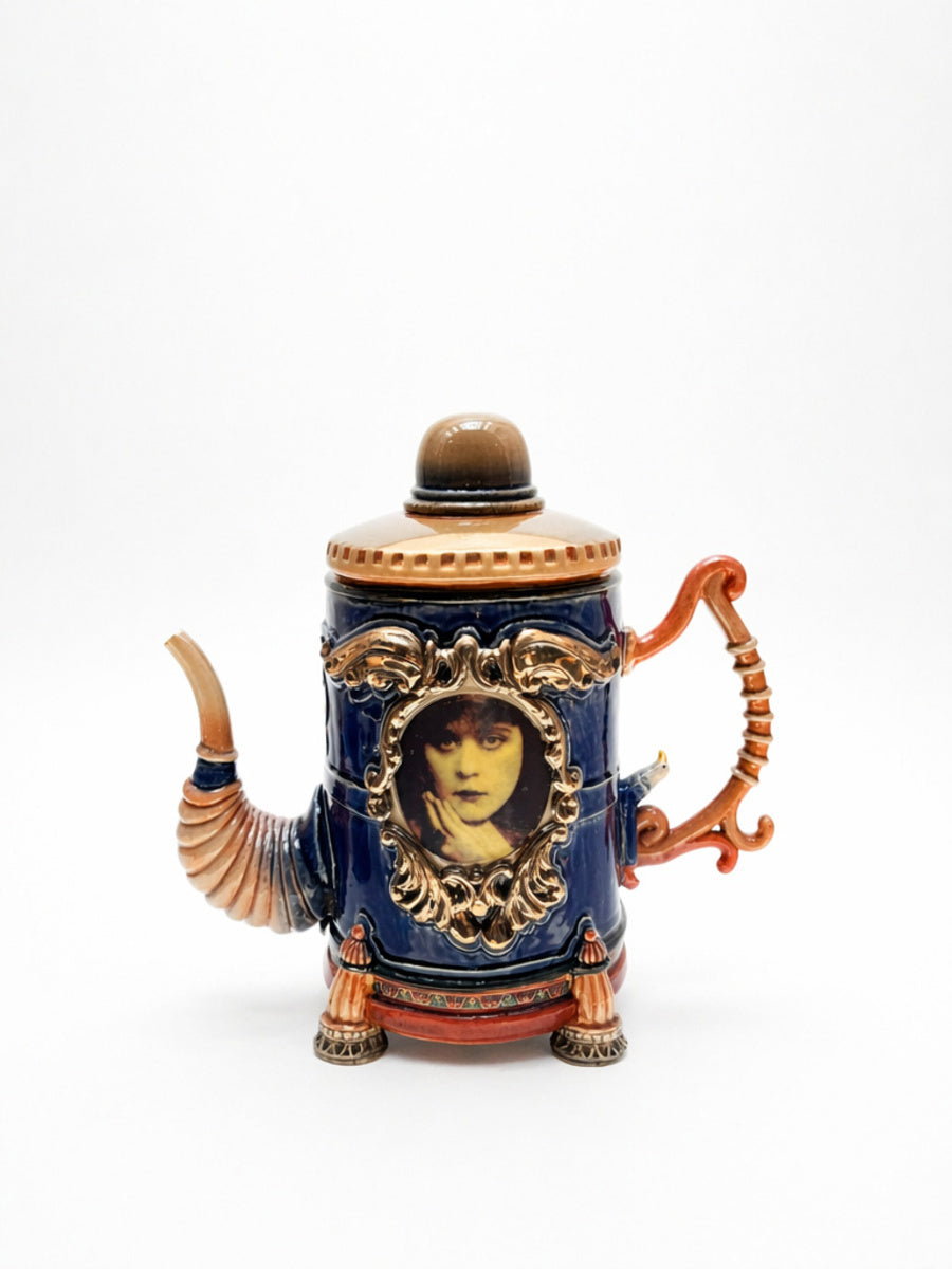Face in Large Blue & Gold Tea Pot